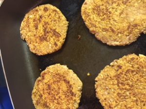 Pinto Bean Burgers cooking in skillet